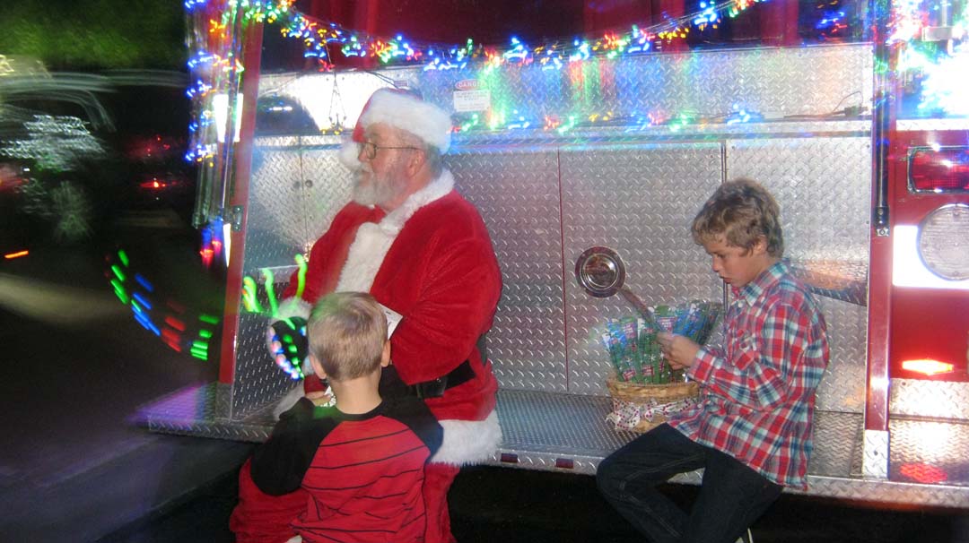 Santa on Back of Fire Truck